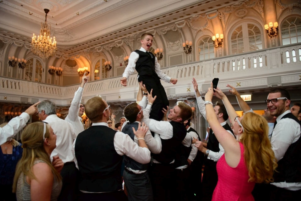 Guests having fun, lifted a boy up.